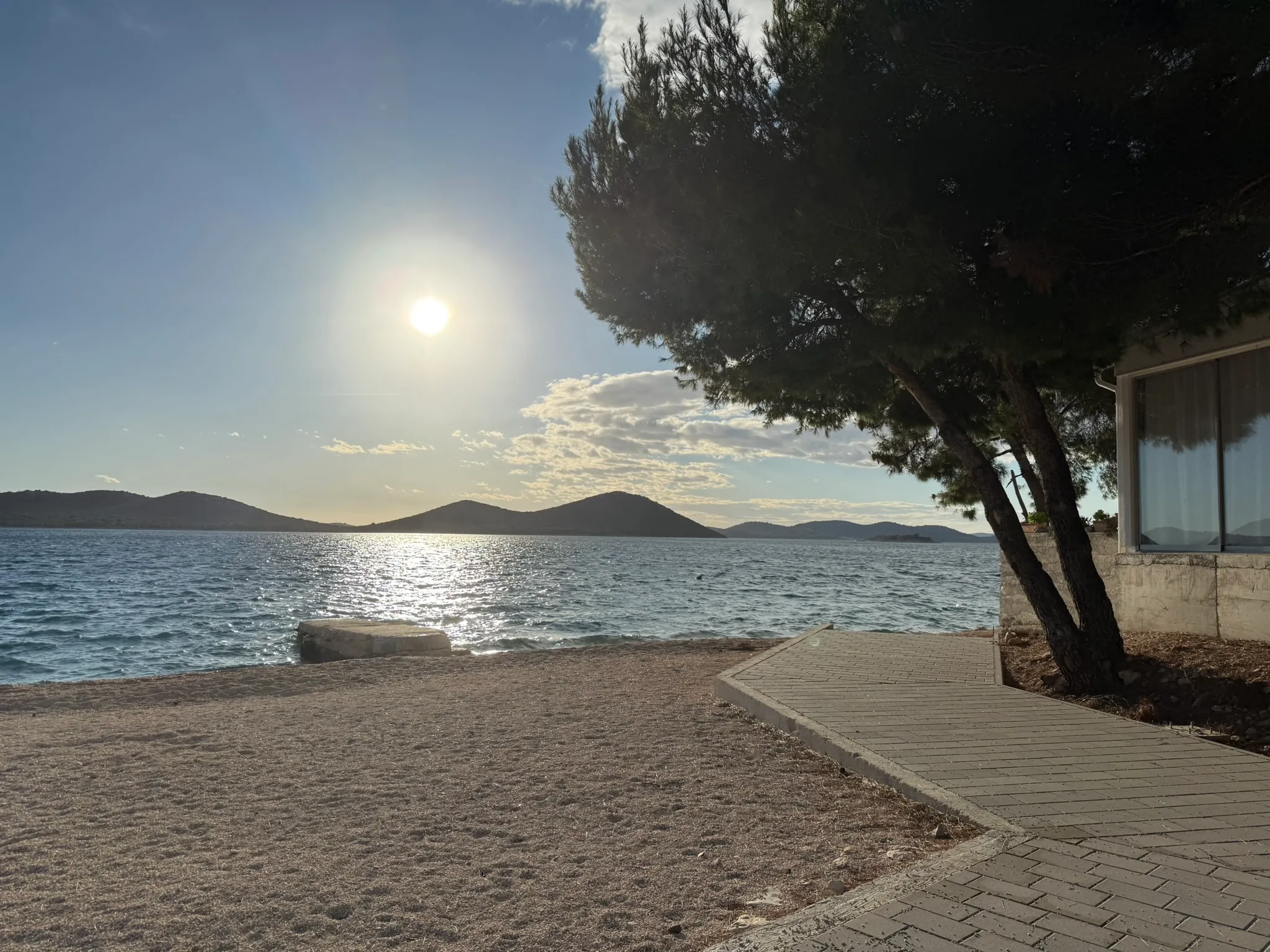 Drage shoreline with Kornati islands in the afternoon sun