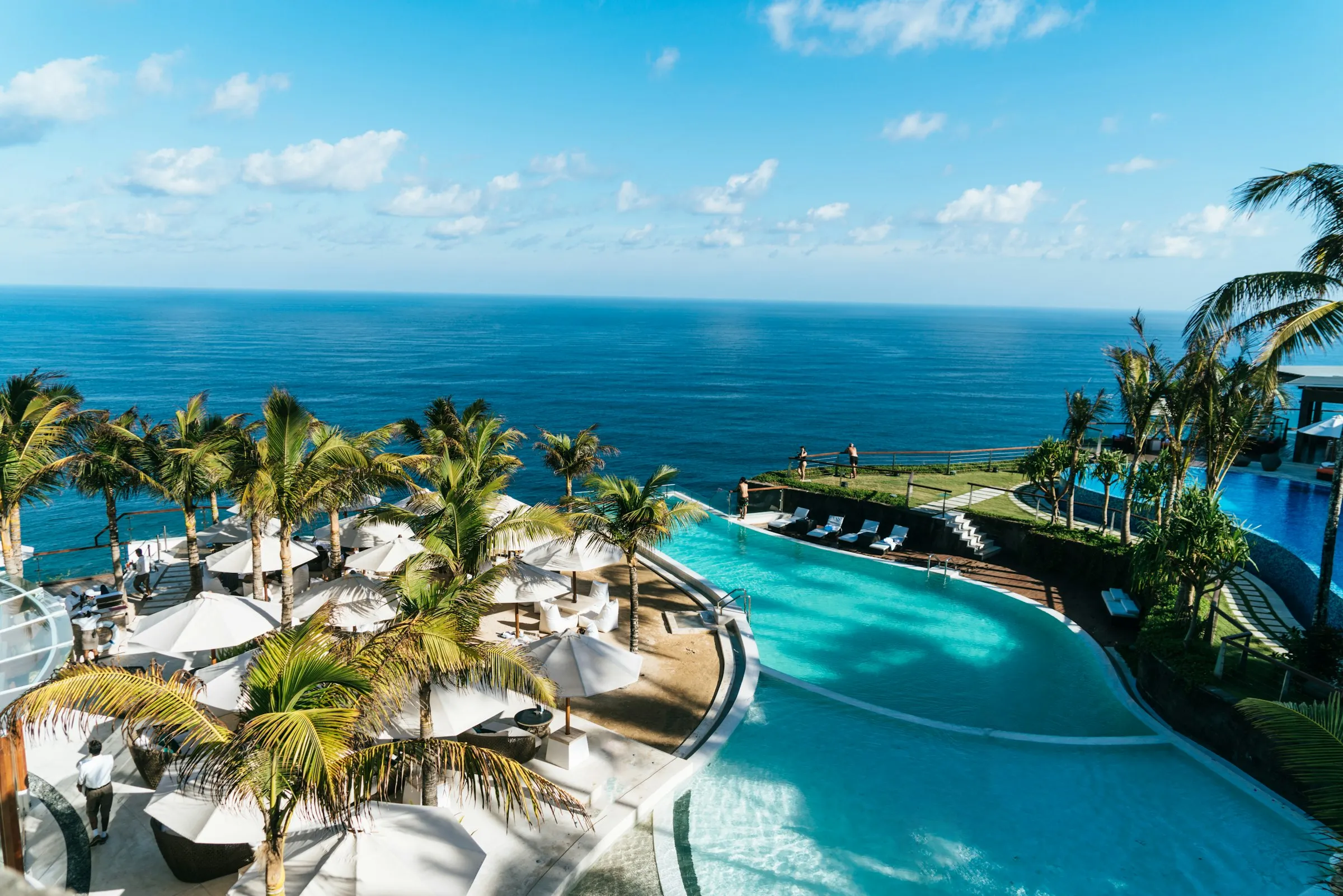 A sea-view terrace and pool above the calm Adriatic at golden hour