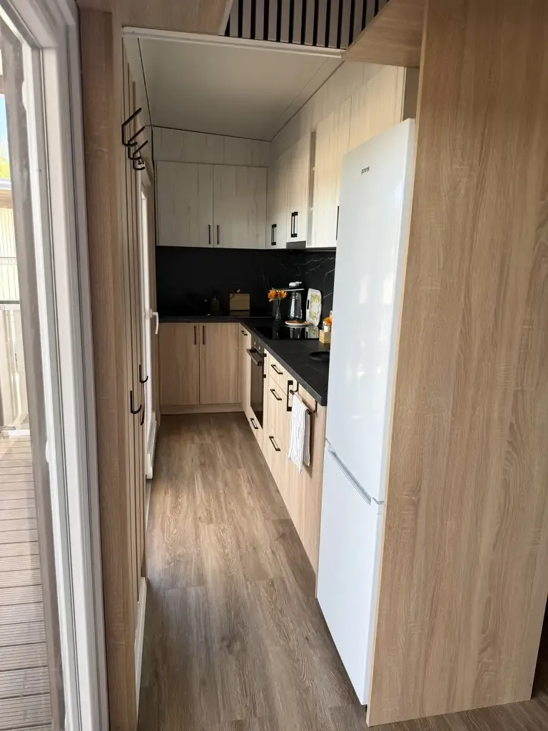 Fully equipped kitchen with refrigerator
