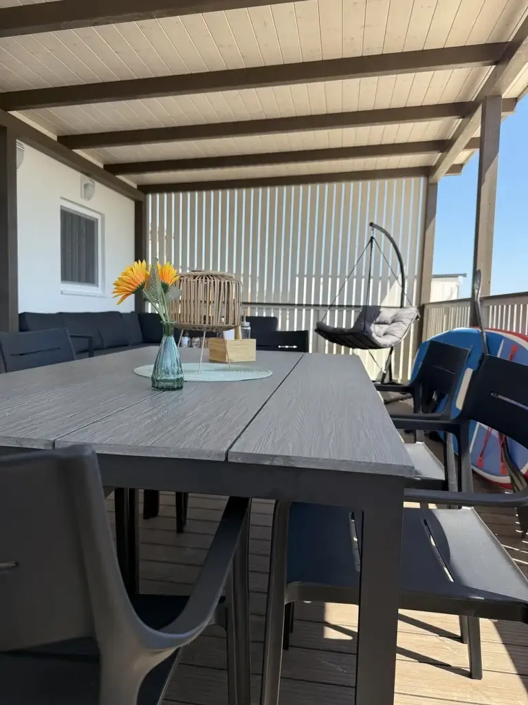 Terrace dining table and lounge seating