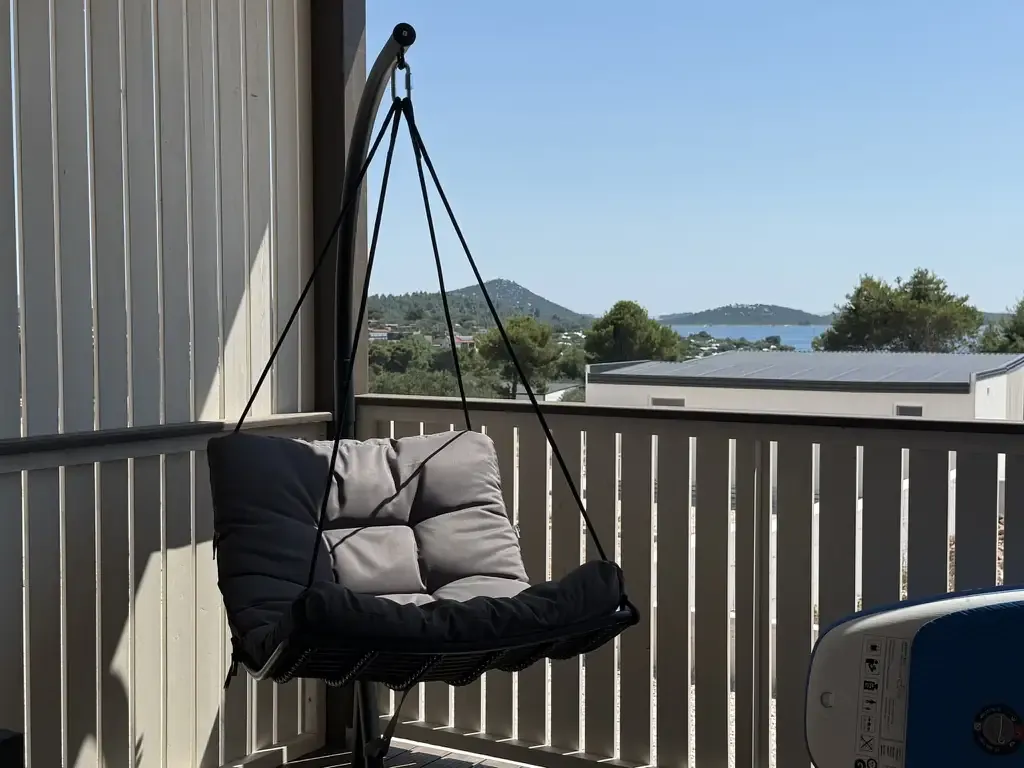 Hanging terrace chair with sea view