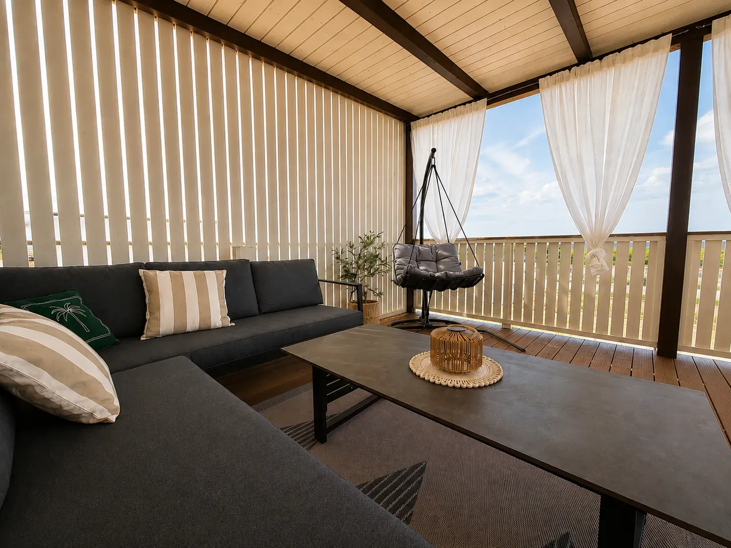 Terrace lounge corner with hanging chair and open sea view