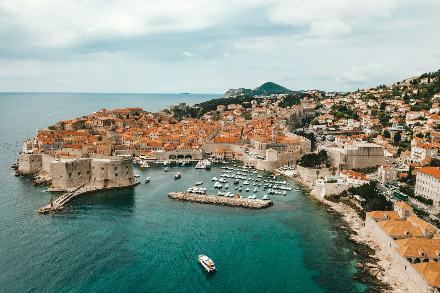 A pale stone Dalmatian town stepping down to a sheltered harbour on the Adriatic